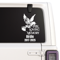 Custom Memorial decal with a dove and flowers on a car window, commemorating 'In Loving Memory