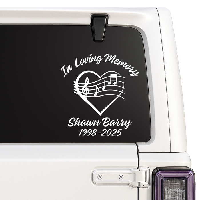 Memorial decal with music notes on a car window