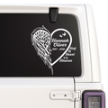 Memorial decal with heart and wings on a car window