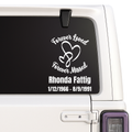 Memorial decal with 'Forever Loved, Forever Missed' text on a car window.