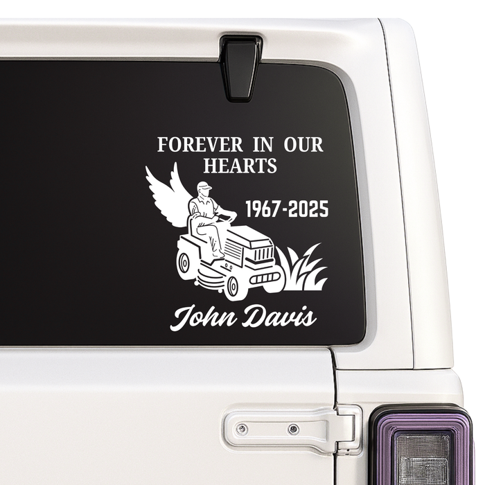 Memorial decal on a vehicle window with text and an illustration of a person on a lawn mower.