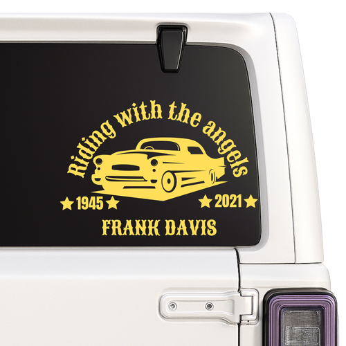 Car window with a yellow graphic and text on a black background