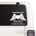 Memorial decal with wings and text on a car window