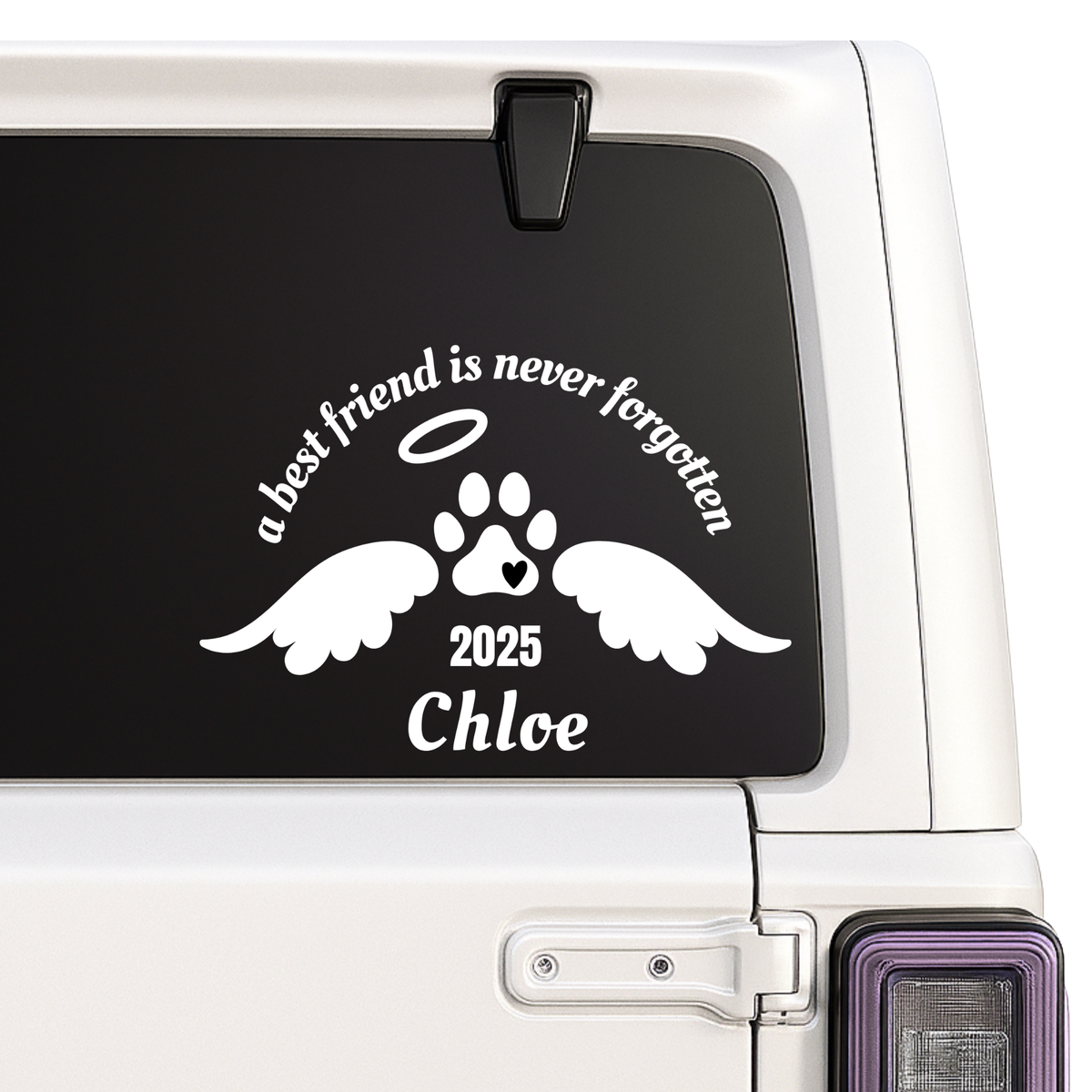 Car window with a decal of a paw print with wings, angelic halo, and text 'a best friend is never forgotten ' on a car window