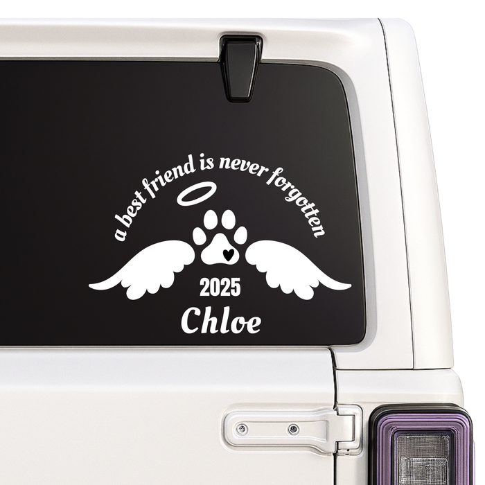 Car window with a decal of a paw print with wings, angelic halo, and text 'a best friend is never forgotten ' on a car window
