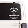 Memorial decal with cross and hands on a car window.