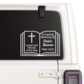 Memorial decal with an open book design on a car window.