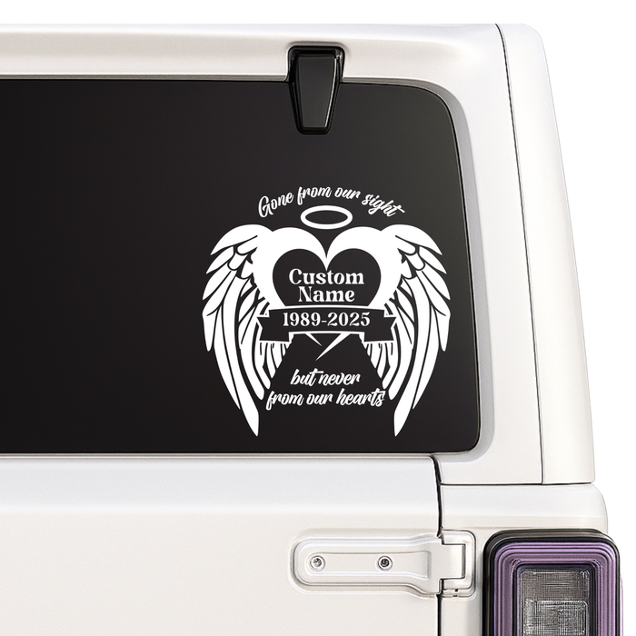 Memorial decal with wings and text on a car window
