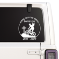 Decal with 'Riding with the Angels' design on a vehicle window