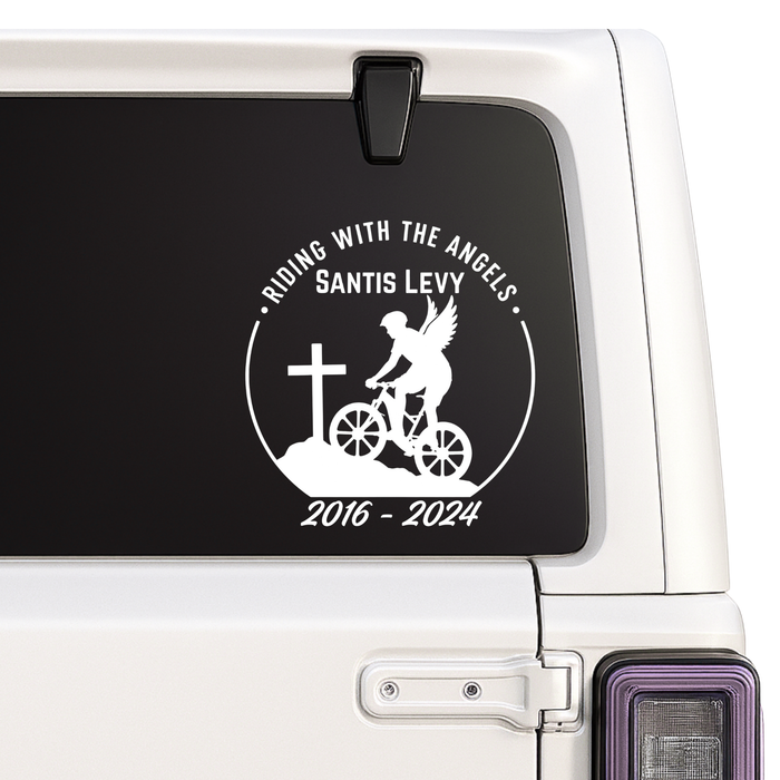 Decal with 'Riding with the Angels' design on a vehicle window