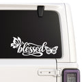 Blessed — butterfly script design design shown on a white Jeep window