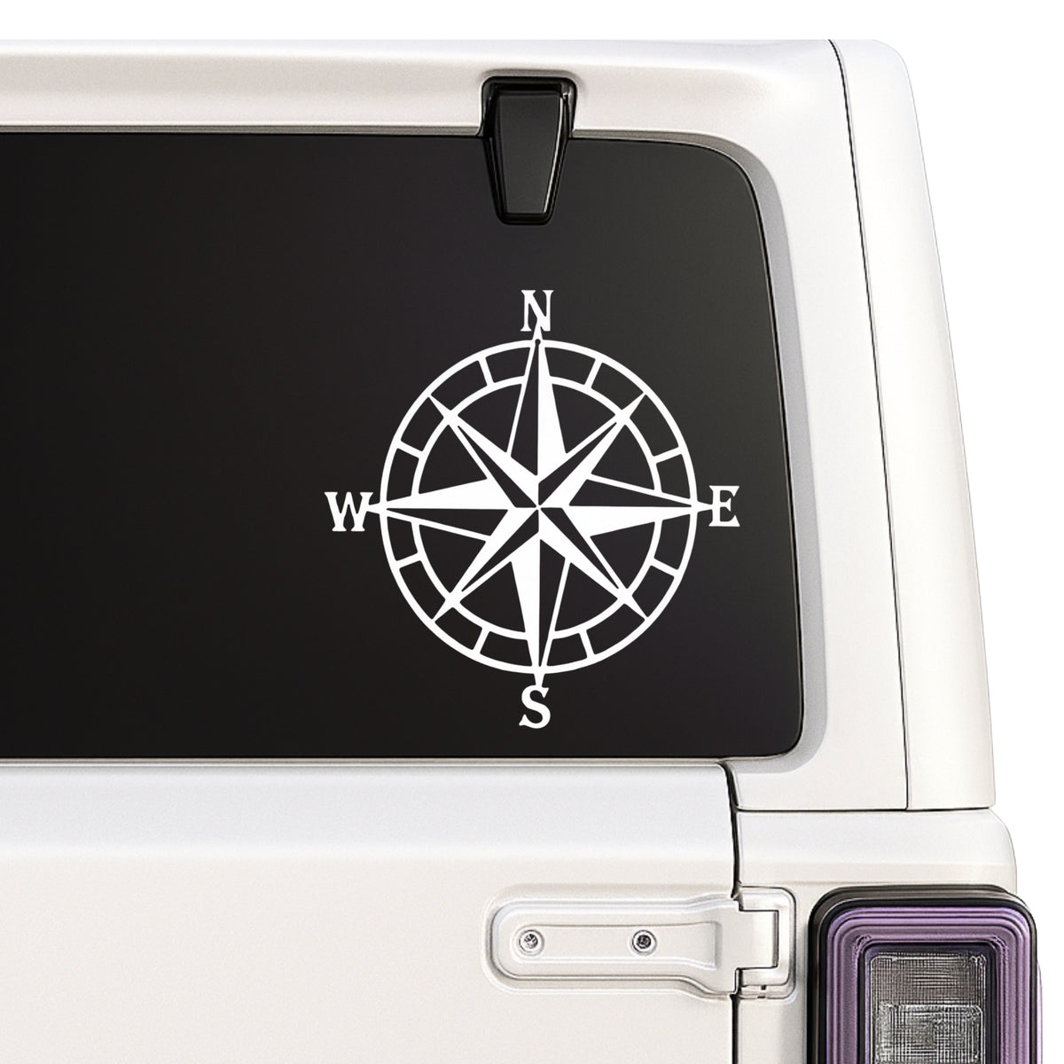 Compass rose — N/E/S/W design shown on a white Jeep window
