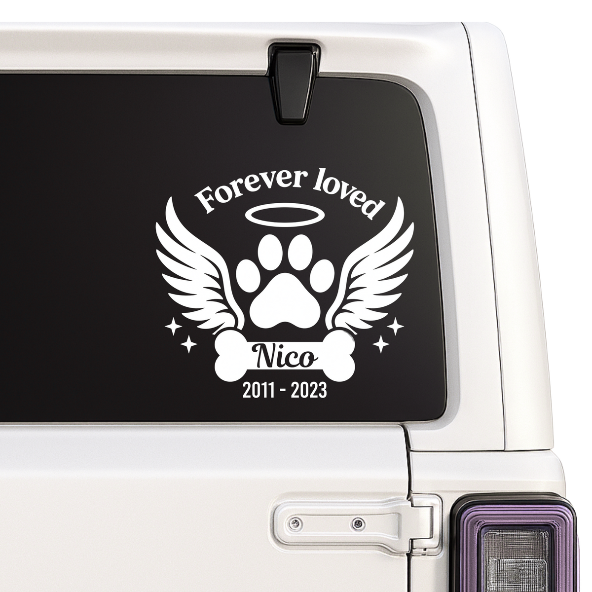 Forever Loved dog memorial decal with angel wings, paw print, halo and personalized name and years on a white vehicle