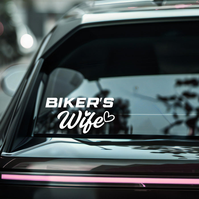 Biker's Wife vinyl car decal sticker on a laptop, featuring bold text and a motorcycle graphic for bikes enthusiasts.