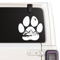 Mountain landscape inside paw print design shown on a white Jeep window