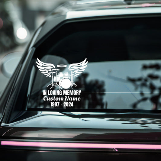 Customizable memorial vinyl decal featuring angel wings and a drummer loving memory design, available in multiple colors.