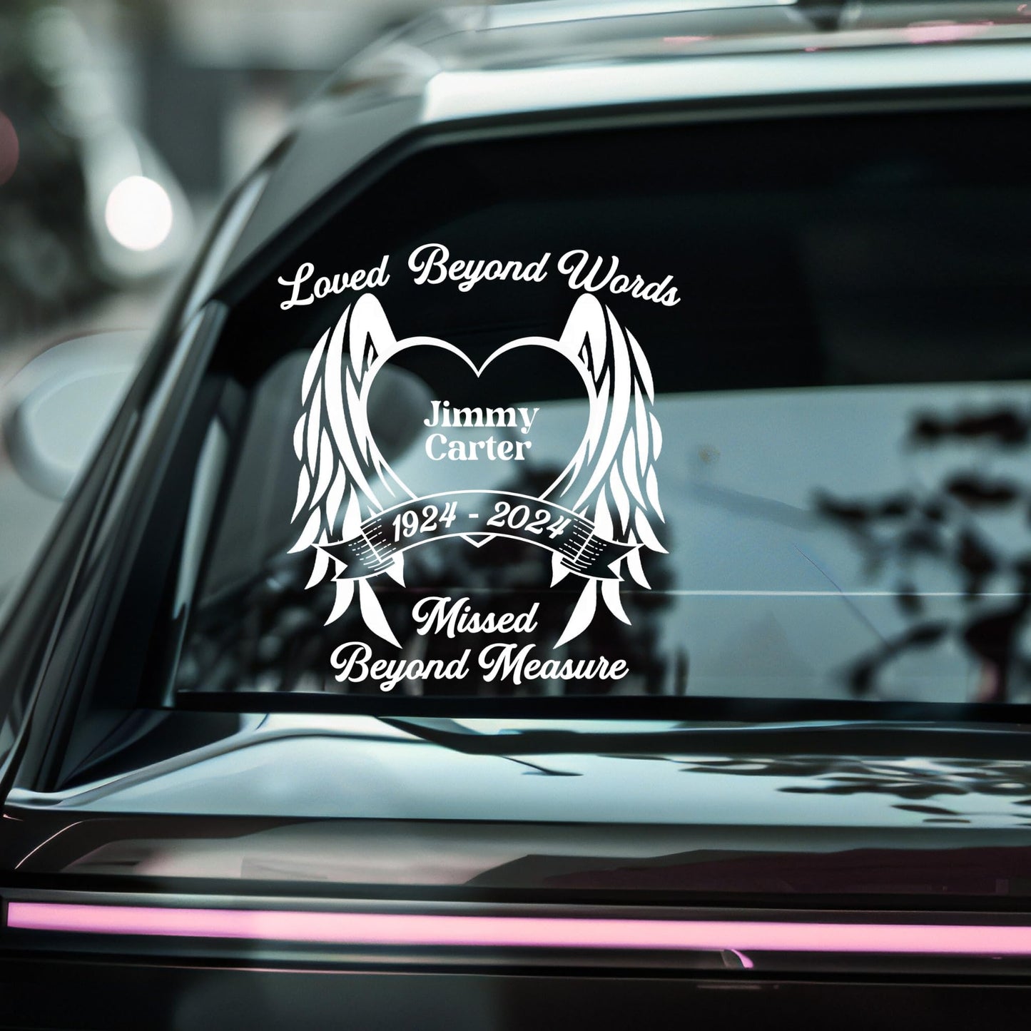 Personalized memorial decal with angel wings and heart, available in 9 colors, designed for honoring loved ones on surfaces.