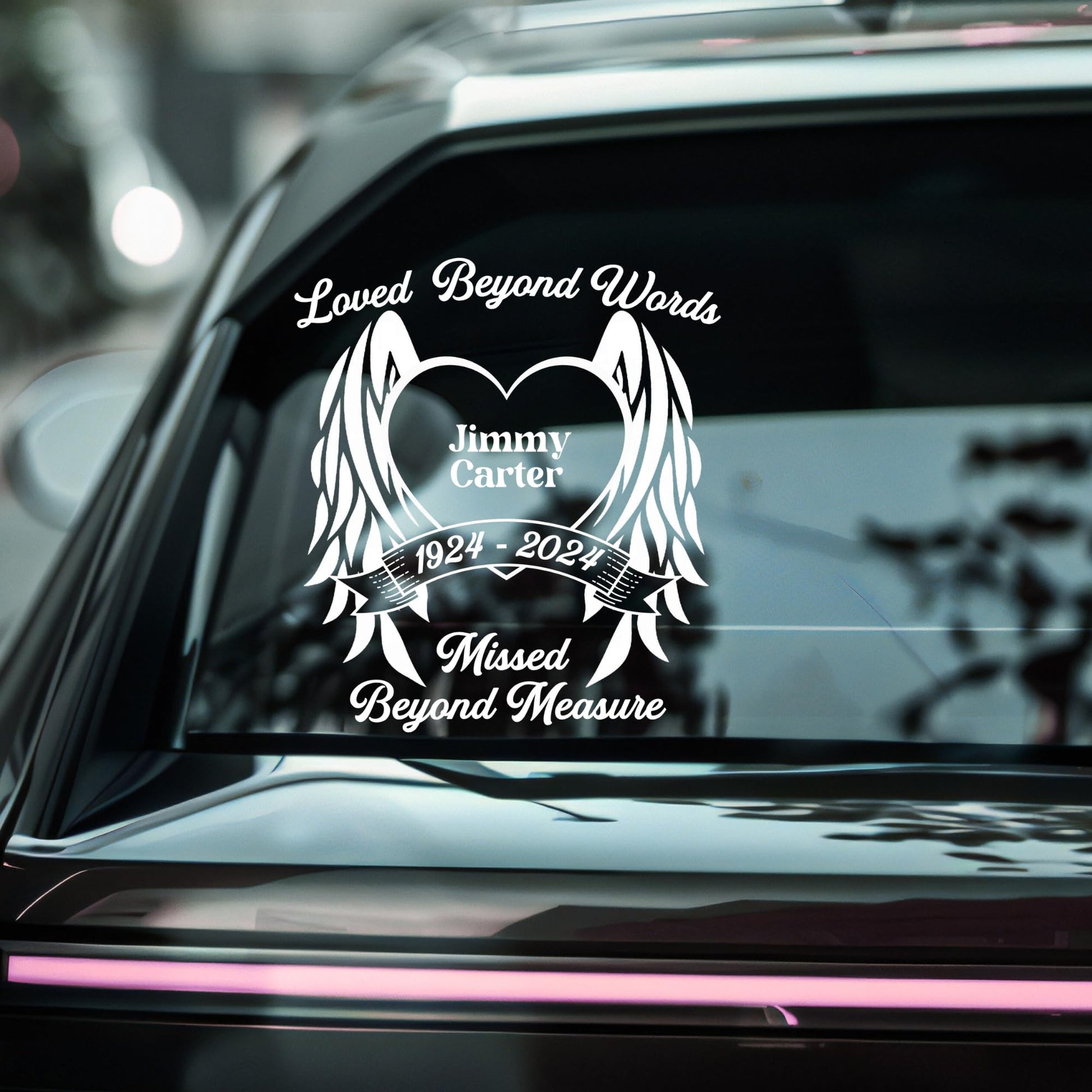 Personalized memorial decal with angel wings and heart, available in 9 colors, designed for honoring loved ones on surfaces.