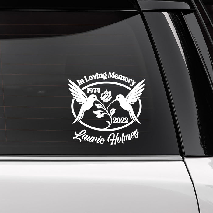 Orange 6-inch hummingbird memorial vinyl decal with custom name and dates, available in 10 colors, for cars or memorial displays.