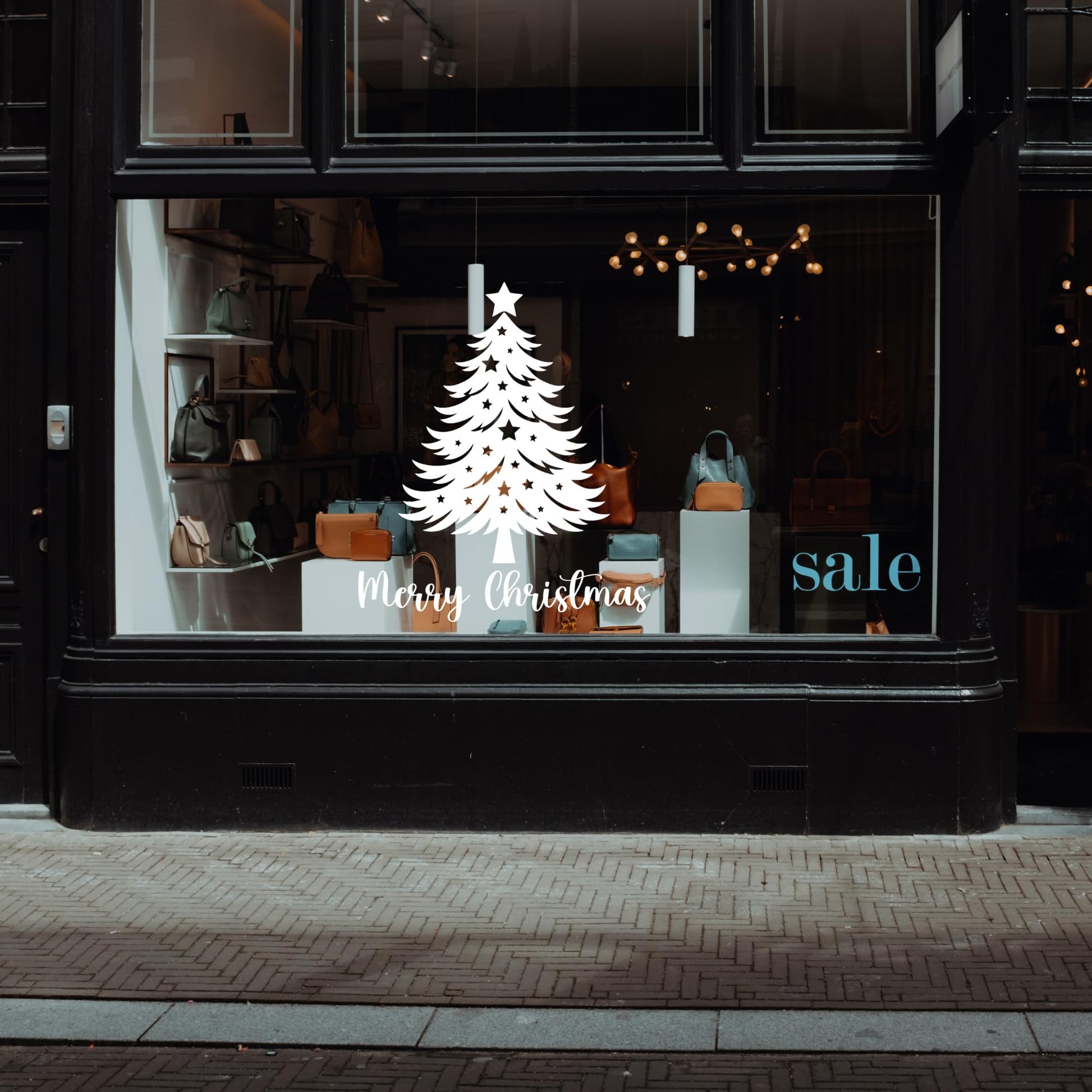 Christmas tree vinyl wall decal with stars and Merry Christmas window sticker by Nostalgi Factory, perfect for festive holiday decor.