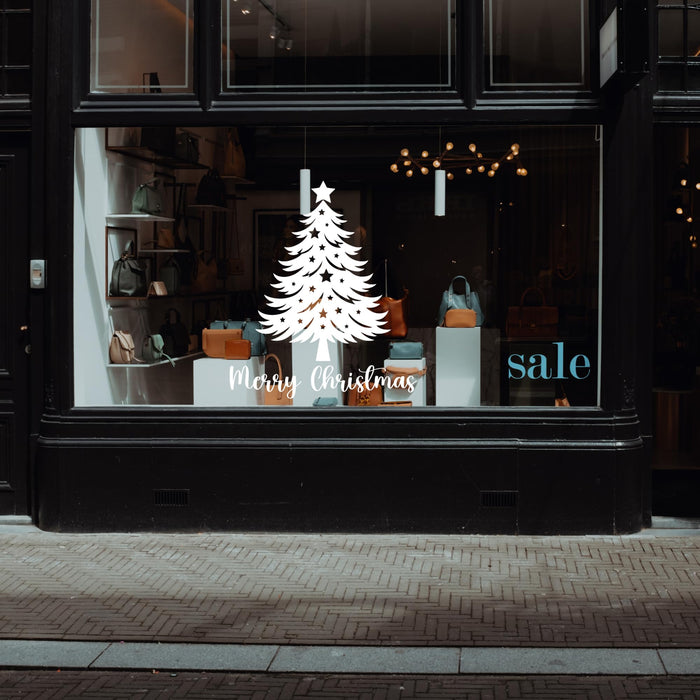 Christmas tree vinyl wall decal with stars and Merry Christmas window sticker by Nostalgi Factory, perfect for festive holiday decor.