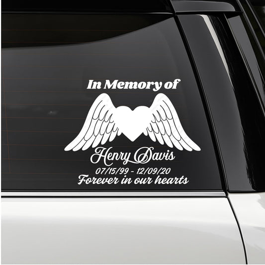 Custom memorial vinyl decal featuring a heart with angel wings, in memory of loved ones, by Nostalgi Factory.