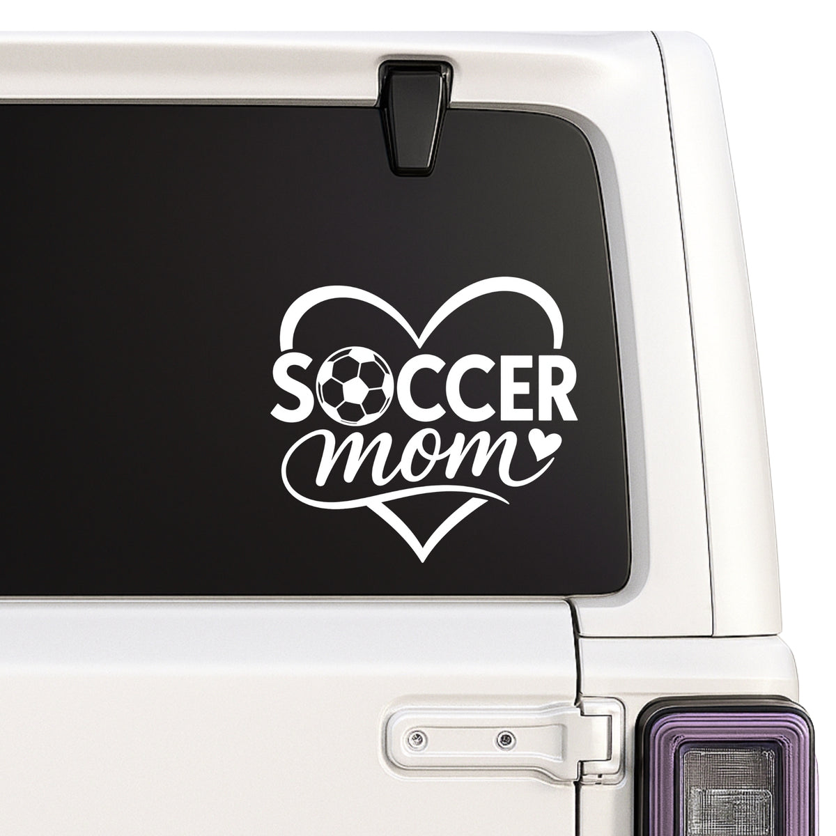 Soccer Mom — heart and soccer ball decal shown on a white Jeep window