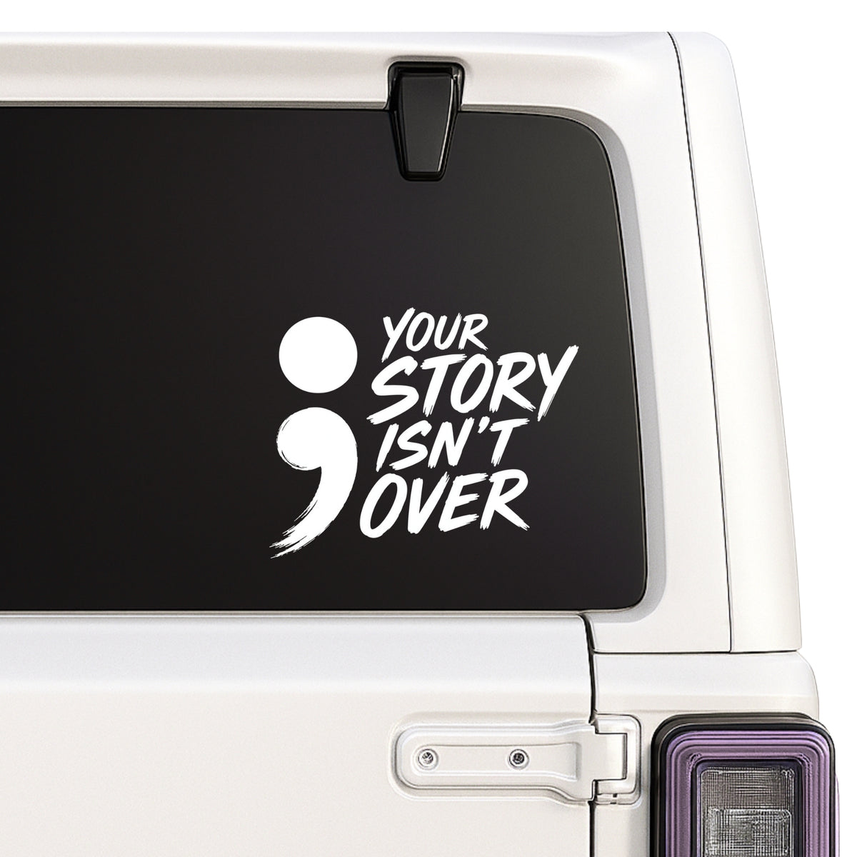 Your Story Isn't Over — semicolon decal shown on a white Jeep window